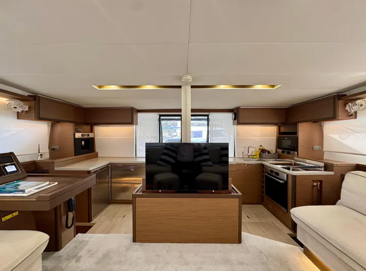 Promprang Yacht Photos Pics Luxurious interior of 2020 Lagoon 50 yacht with modern kitchen and entertainment area.