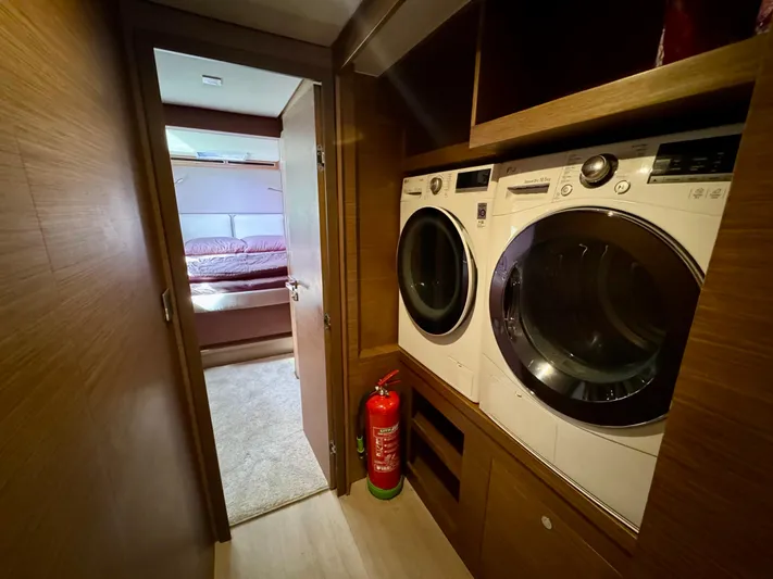 Promprang Yacht Photos Pics Laundry area with washer and dryer inside a 2020 Lagoon 50 yacht.