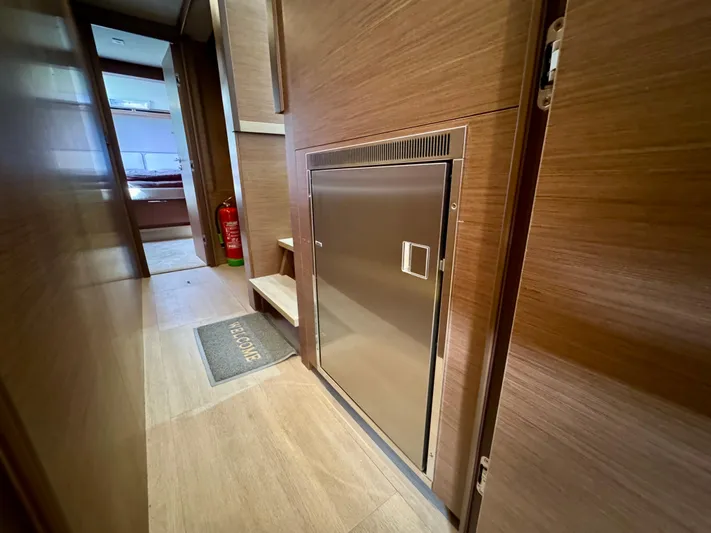 Promprang Yacht Photos Pics Interior of 2020 Lagoon 50 yacht with wooden finish and stainless steel door.