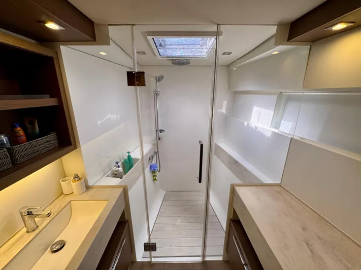 Promprang Yacht Photos Pics Luxurious bathroom in 2020 Lagoon 50 yacht with modern shower and elegant fixtures.