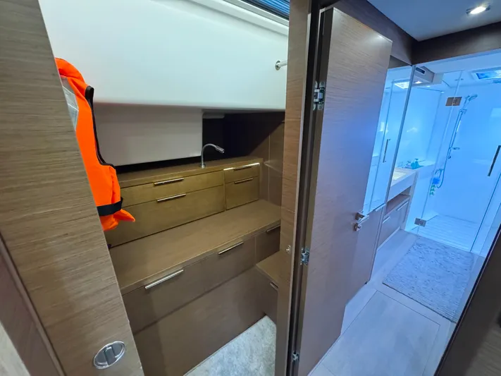 Promprang Yacht Photos Pics Interior of 2020 Lagoon 50 yacht with modern bathroom and storage area.