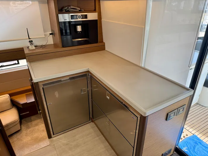 Promprang Yacht Photos Pics Modern kitchen area in a 2020 Lagoon 50 yacht with stainless steel appliances.