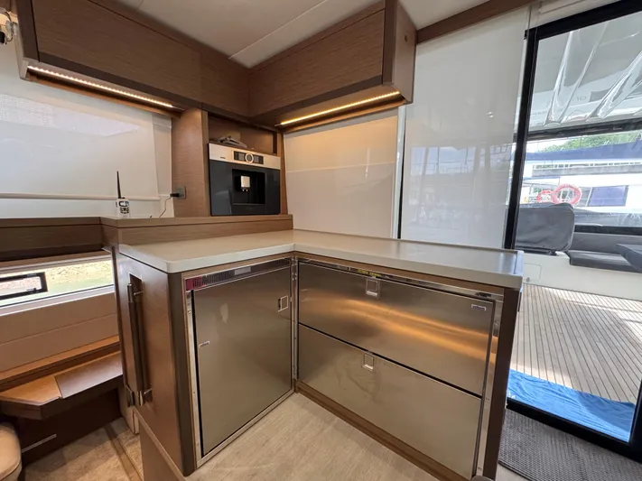 Promprang Yacht Photos Pics Modern kitchen area in a 2020 Lagoon 50 yacht with stainless steel appliances.