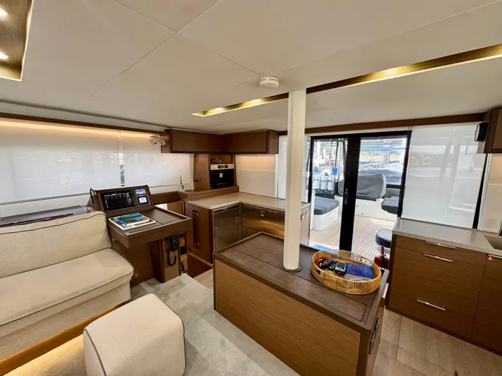 Promprang Yacht Photos Pics Luxurious interior of 2020 Lagoon 50 yacht with modern kitchen and seating area.