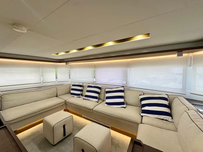 Promprang Yacht Photos Pics Luxurious interior of 2020 Lagoon 50 yacht with striped cushions and modern seating.