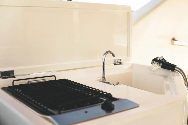  Yacht Photos Pics Outdoor kitchen area on 2005 Canados 72 S yacht with sink and grill.