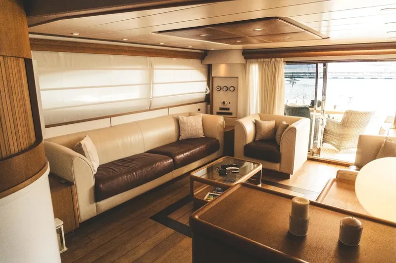  Yacht Photos Pics Luxurious interior of 2005 Canados 72 S yacht with elegant seating and wooden accents.