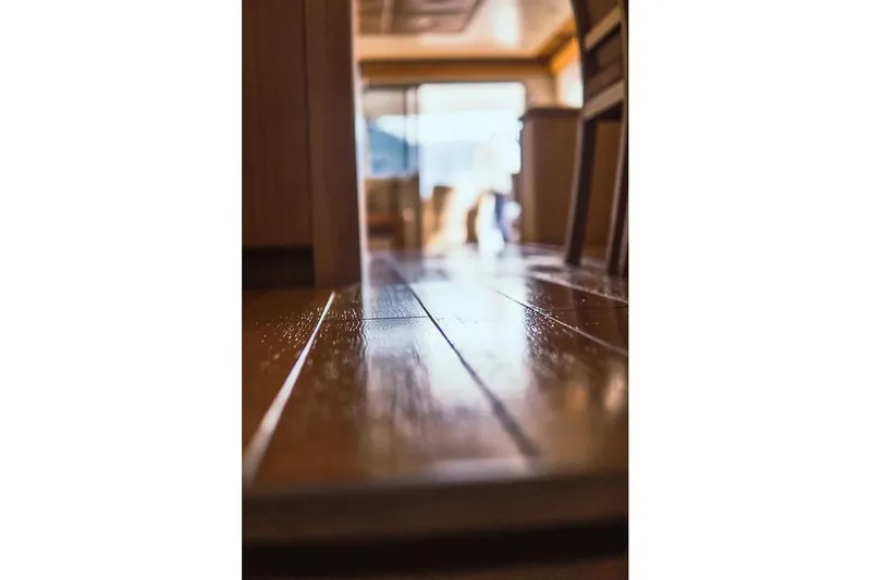  Yacht Photos Pics Polished wooden floor inside 2005 Canados 72 S yacht, showcasing luxury interior design.