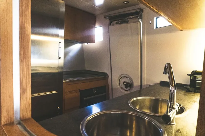  Yacht Photos Pics Luxurious kitchen interior of 2005 Canados 72 S yacht with modern amenities.