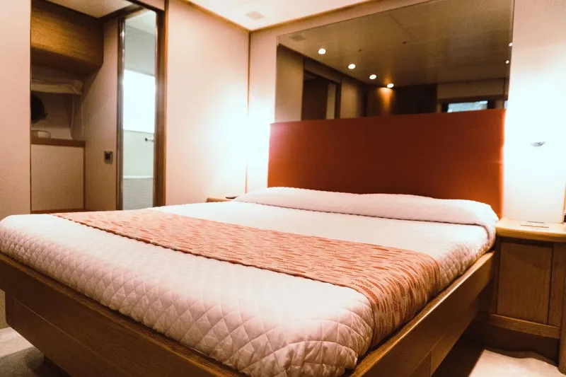  Yacht Photos Pics Luxurious bedroom interior of 2005 Canados 72 S yacht with elegant lighting and decor.