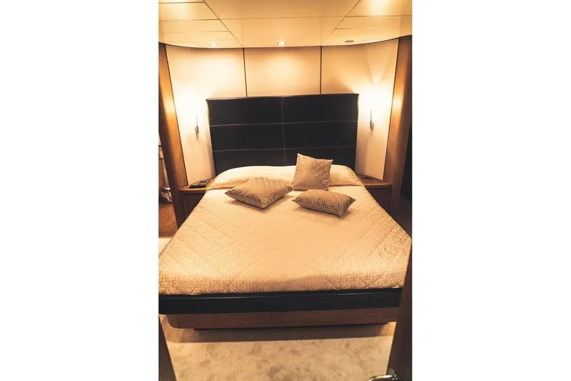  Yacht Photos Pics Luxurious bedroom interior of 2005 Canados 72 S yacht with elegant bedding and lighting.