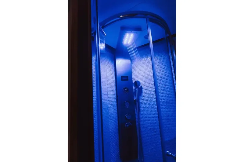 Yacht Photos Pics Luxurious blue-lit shower in 2005 Canados 72 S yacht.