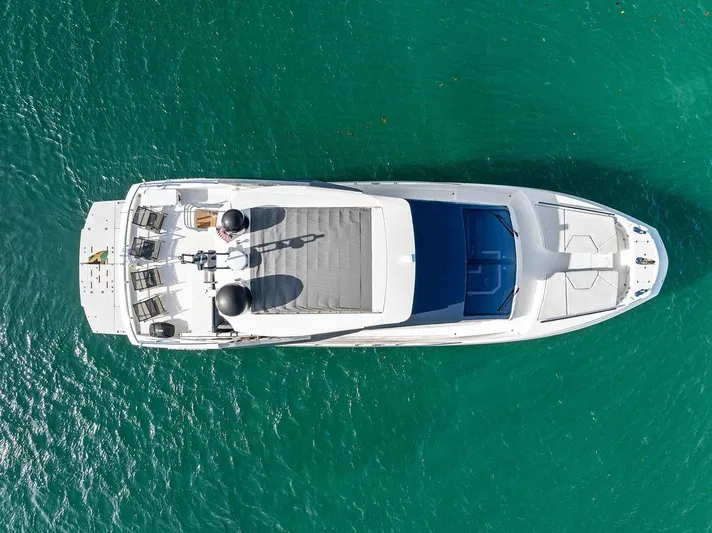 Greyt Escape Yacht Photos Pics Aerial view of 2013 Astondoa 72 GLX yacht on turquoise water.