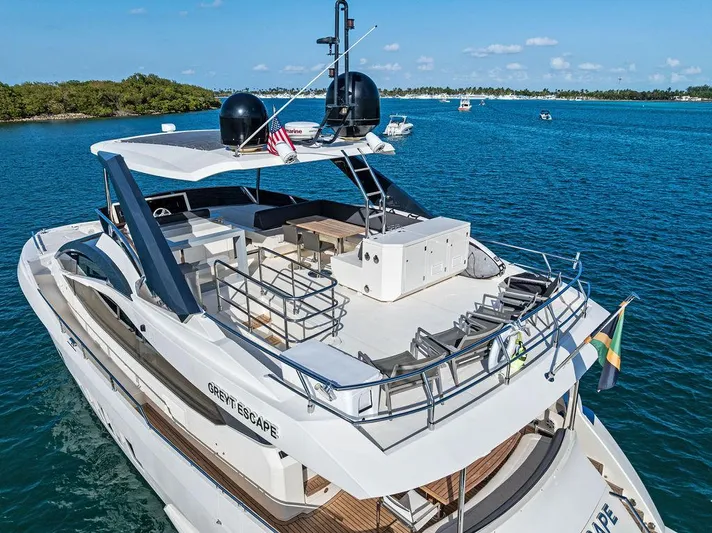 Greyt Escape Yacht Photos Pics Luxurious 2013 Astondoa 72 GLX yacht cruising on clear blue waters.