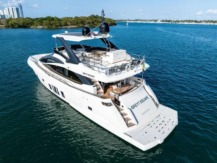 Greyt Escape Yacht Photos Pics Luxurious 2013 Astondoa 72 GLX yacht cruising on serene blue waters.