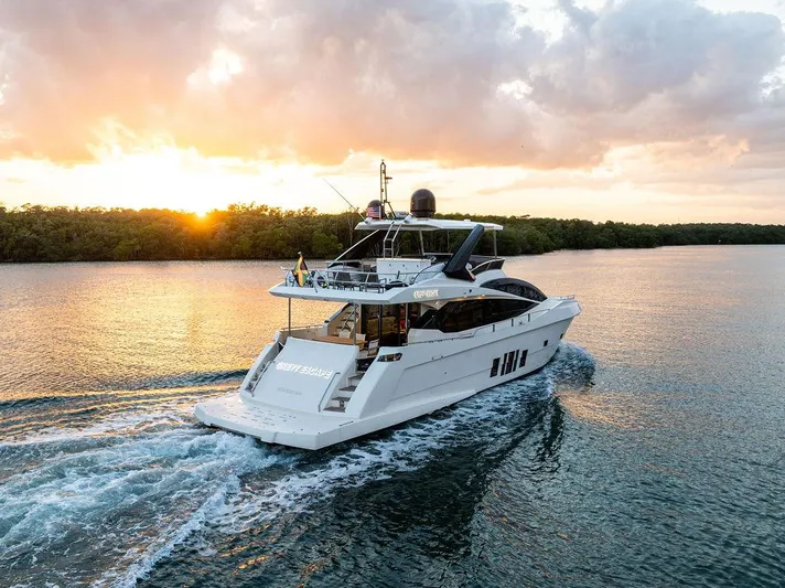 Greyt Escape Yacht Photos Pics Astondoa 72 GLX yacht cruising at sunset, 2013 model, serene water backdrop.