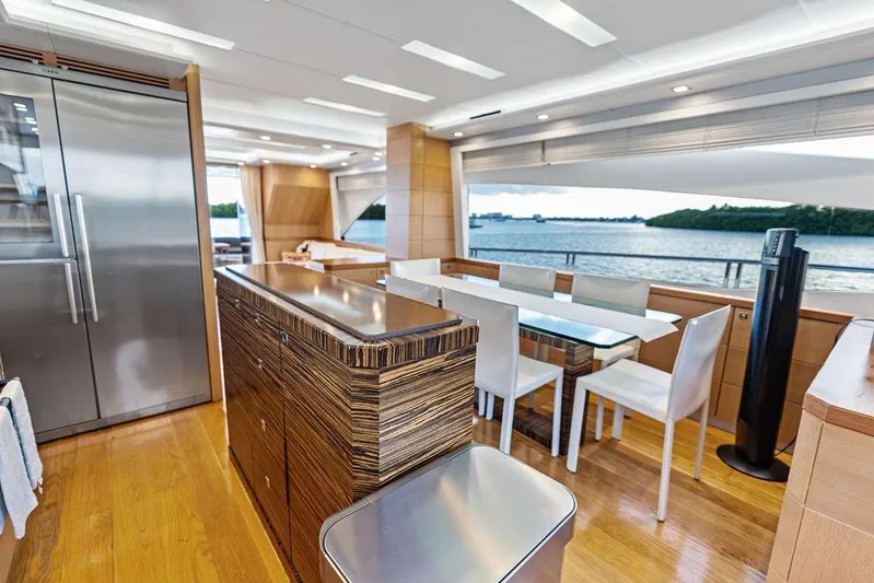 Greyt Escape Yacht Photos Pics Luxurious interior of 2013 Astondoa 72 GLX yacht with modern dining area and scenic ocean view.