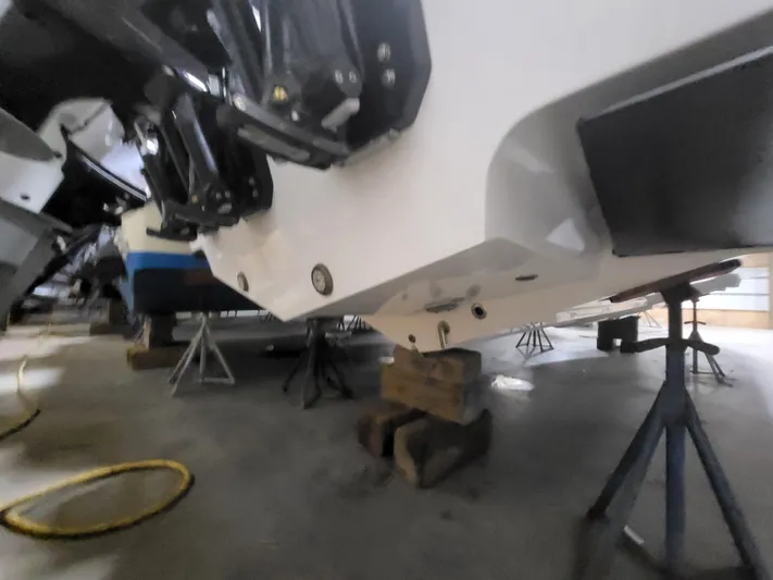  Yacht Photos Pics 2022 Fountain 38 SC boat on stands in a garage setting.