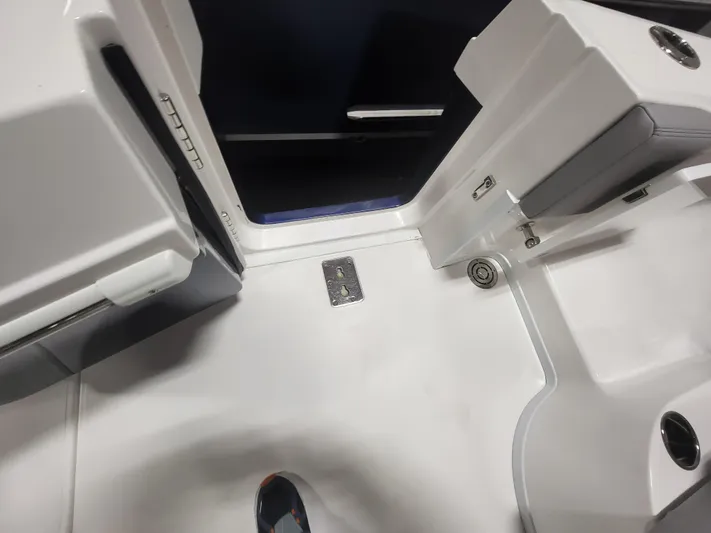  Yacht Photos Pics Interior view of a 2022 Fountain 38 SC boat, showcasing sleek white surfaces and modern design.