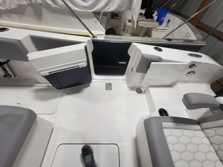  Yacht Photos Pics 2022 Fountain 38 SC boat interior with seating and open door.