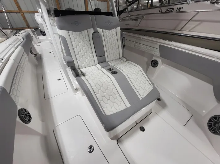  Yacht Photos Pics 2022 Fountain 38 SC boat interior with stylish seating and modern design.