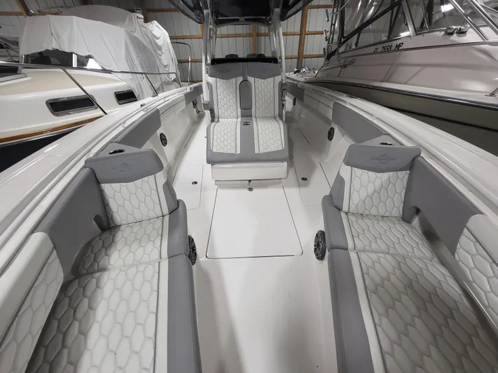  Yacht Photos Pics 2022 Fountain 38 SC boat interior with sleek seating and modern design.
