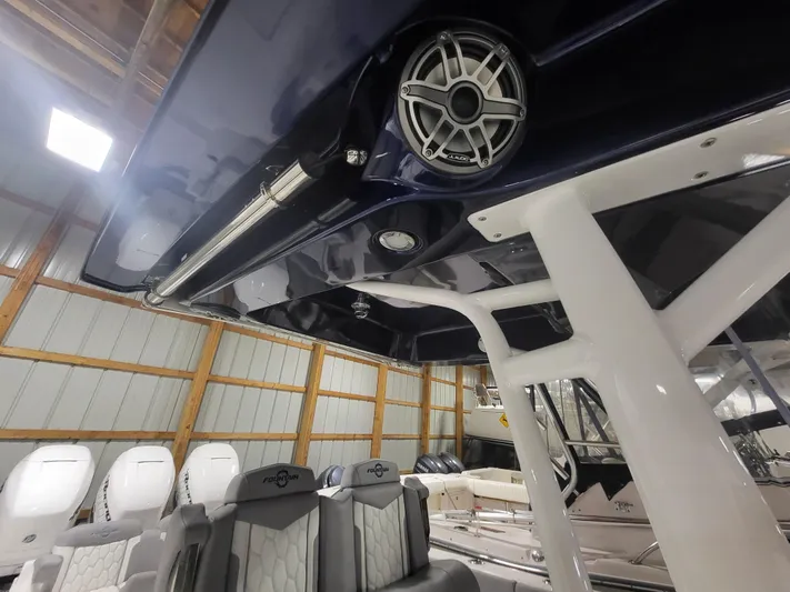  Yacht Photos Pics 2022 Fountain 38 SC boat interior with seating and speaker system.