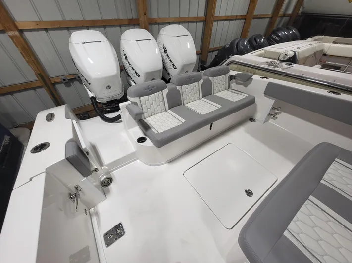  Yacht Photos Pics 2022 Fountain 38 SC boat with triple outboard engines and spacious seating.