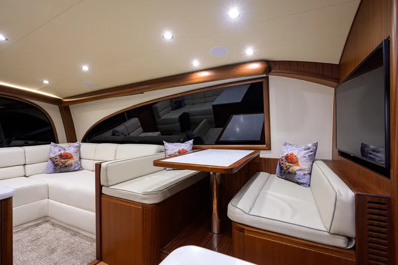  Yacht Photos Pics Luxurious interior of 2022 F&S 58 Custom Carolina yacht with elegant seating and modern design.