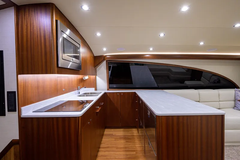  Yacht Photos Pics Luxurious interior of 2022 F&S 58 Custom Carolina yacht with modern kitchen design.