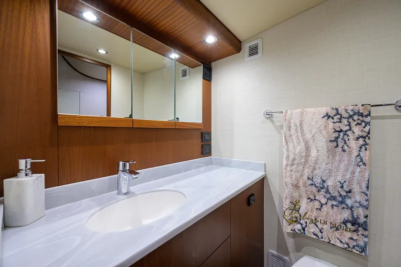  Yacht Photos Pics Luxurious bathroom in 2022 F&S 58 Custom Carolina yacht with modern fixtures and elegant design.