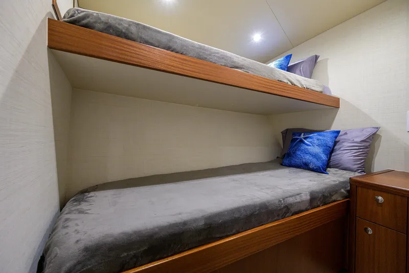  Yacht Photos Pics Bunk beds in 2022 F&S 58 Custom Carolina yacht cabin with blue pillows.