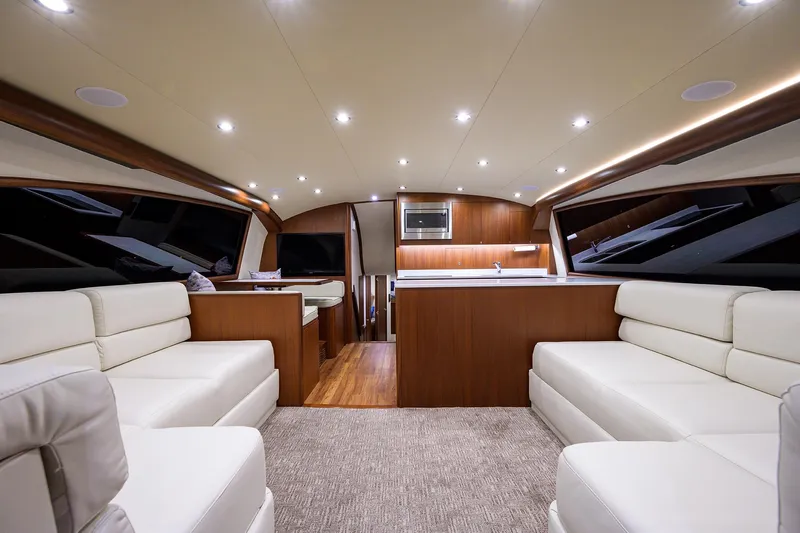  Yacht Photos Pics Luxurious interior of 2022 F&S 58 Custom Carolina yacht with elegant seating and modern design.