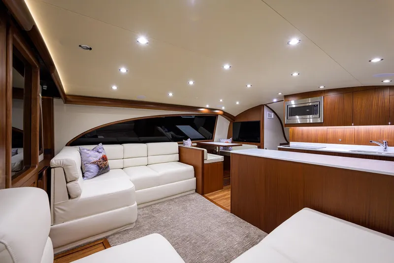  Yacht Photos Pics Luxurious interior of 2022 F&S 58 Custom Carolina yacht with modern furnishings and ambient lighting.