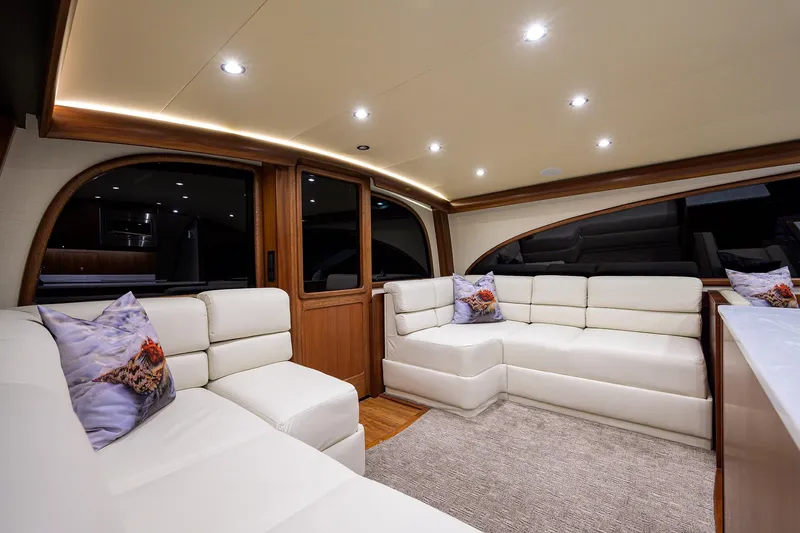  Yacht Photos Pics Luxurious interior of 2022 F&S 58 Custom Carolina yacht with white leather seating.