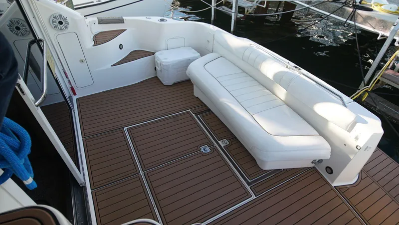  Yacht Photos Pics 1998 Sea Ray 400 Sedan Bridge boat deck with white seating and teak flooring.