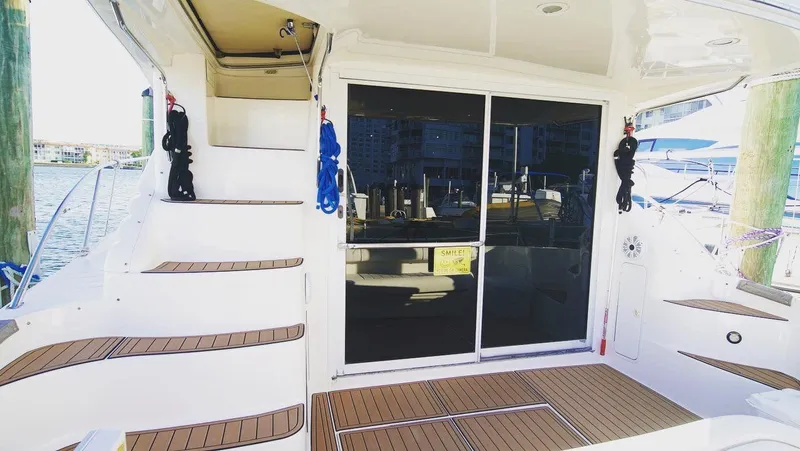  Yacht Photos Pics 1998 Sea Ray 400 Sedan Bridge yacht with teak deck and sliding glass doors.