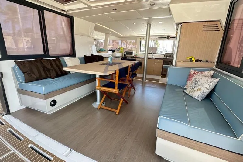  Yacht Photos Pics Interior of 2016 Catana Group Bali 4.0 catamaran with seating and dining area.