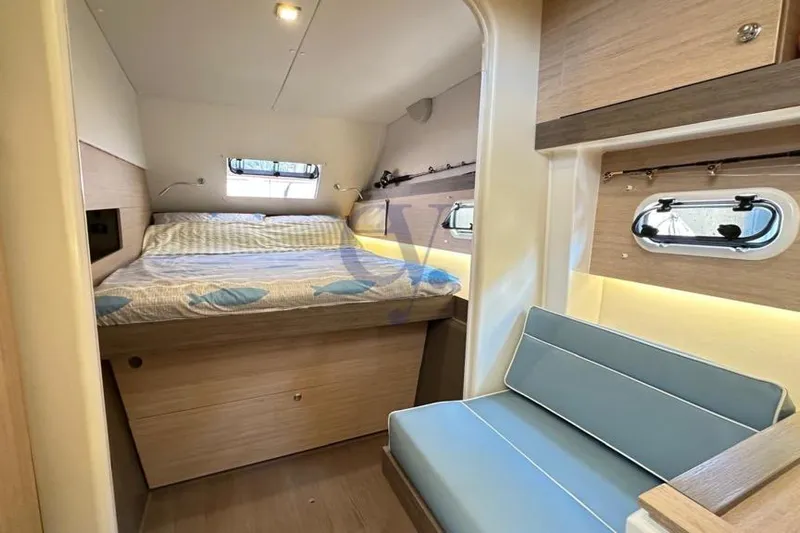  Yacht Photos Pics Luxurious cabin interior of 2016 Catana Group Bali 4.0 catamaran with cozy bed and seating.