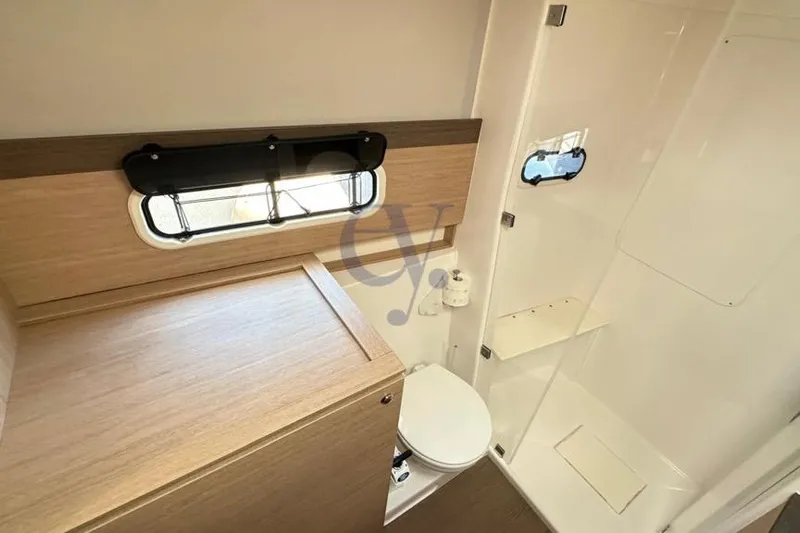  Yacht Photos Pics Bathroom interior of 2016 Catana Group Bali 4.0 catamaran, featuring modern fixtures and wood accents.