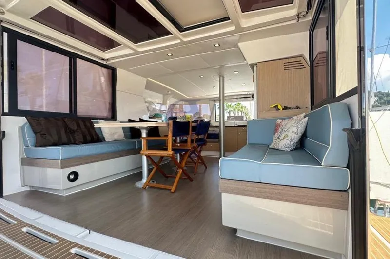  Yacht Photos Pics Spacious interior of 2016 Catana Group Bali 4.0 catamaran with modern seating and dining area.