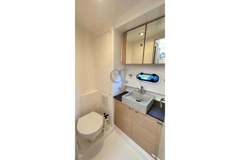  Yacht Photos Pics Bathroom interior of 2016 Catana Group Bali 4.0 yacht with sink, toilet, and mirror.