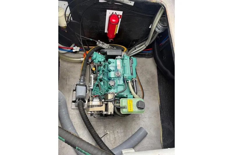  Yacht Photos Pics Engine compartment of 2016 Catana Group Bali 4.0 catamaran, featuring a green marine engine.