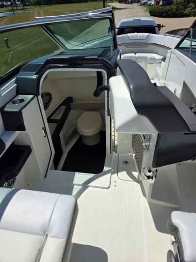  Yacht Photos Pics 2016 Formula 290 Bowrider interior with seating and compact restroom.