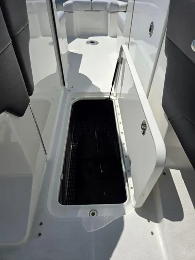  Yacht Photos Pics 2016 Formula 290 Bowrider storage compartment open, showcasing interior space and design.