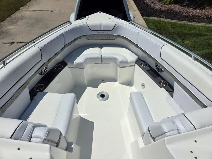  Yacht Photos Pics 2016 Formula 290 Bowrider boat interior with white seating and cup holders.