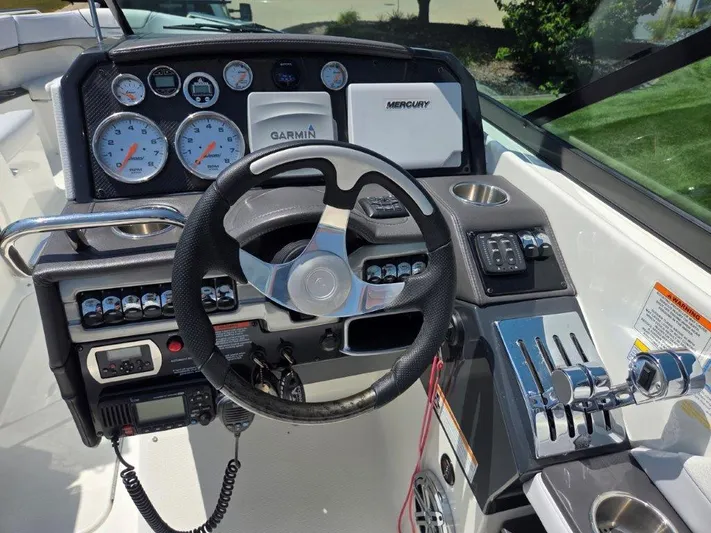 Yacht Photos Pics 2016 Formula 290 Bowrider dashboard with steering wheel, gauges, and controls.