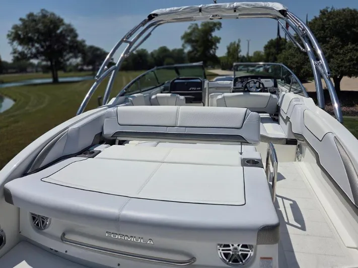  Yacht Photos Pics 2016 Formula 290 Bowrider boat with spacious seating and sleek design, parked outdoors.