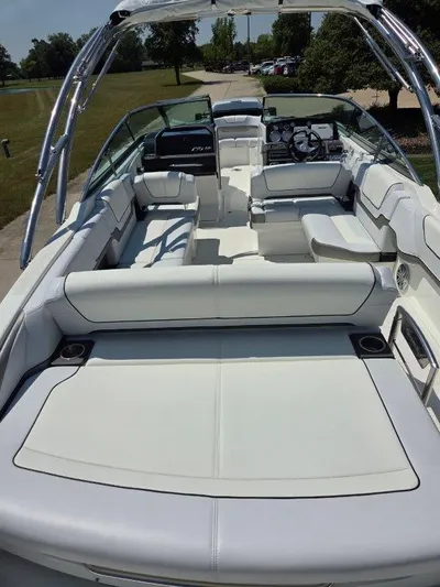  Yacht Photos Pics 2016 Formula 290 Bowrider with spacious seating and sleek design in a sunny outdoor setting.