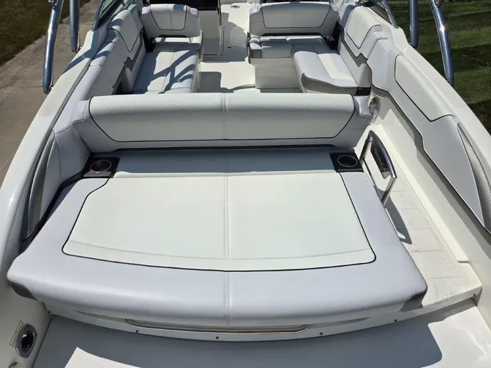  Yacht Photos Pics 2016 Formula 290 Bowrider interior with white seating and cup holders.